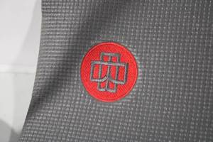 lot 112 image: Gray Yoga Mat with Red Logo - 24 x 71