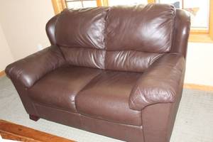 lot 42 image: Gently Used Leather Loveseat in Brown