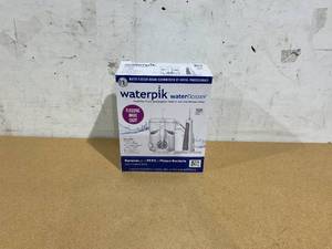 lot 392 image: Waterpik Ultra Plus and Cordless Freedom Water Flosser