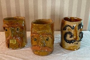 lot 140 image: Awesome Clay Mustachioed Face Mug Collection - (3)