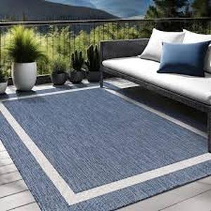 lot 39 image: Waikiki BlueWhite 8 ft. x 10 ft. Bordered IndoorOutdoor Area Rug