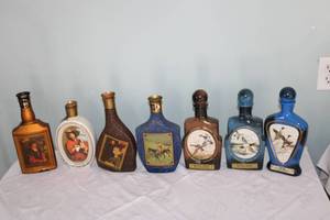 lot 64 image: Collection of 7 Vintage Jim Beam Decanters with Various Designs
