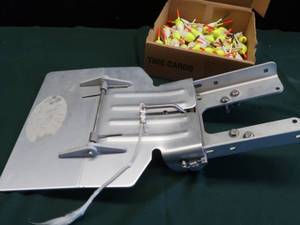 lot 54 image: TROLLING MOTOR MOUNTING PLATE WITH BOX OF BOBBERS