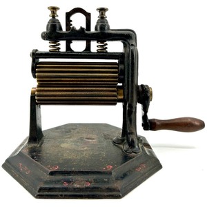lot 2 image: Antique EUREKA Cast Iron Hand Crank Pleating Iron