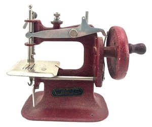 lot 7 image: Vintage Stitch Mistress Toy Sewing Machine