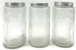 lot 13 image: Set of 3 Vintage Hoosier Ribbed Glass Jars with Metal Lids