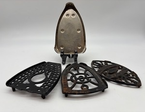 lot 50 image: Set of 3 Antique Cast Iron Iron Stands, 1 Metal Iron Stand