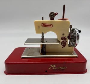 lot 72 image: Vintage Jet Sew-O-Matic AStraco Toy Sewing Machine