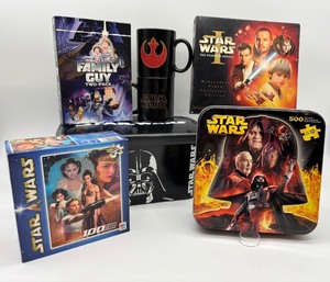 lot 91 image: Star Wars Collectible Lot Puzzles, DVDs, and Mugs
