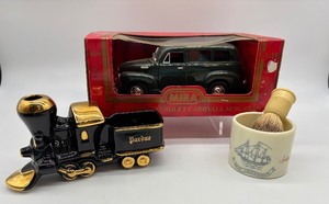 lot 110 image: Die-Cast 1950 Chevrolet Suburban, Ceramic Train Bank & Shaving Mug with Brush