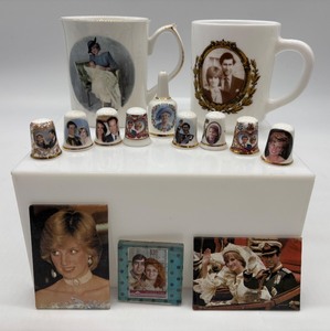 lot 297 image: Royal Collectible Set Mugs, Thimbles, Magnets and Small Bell, Featuring Princess Diana and Royal Family