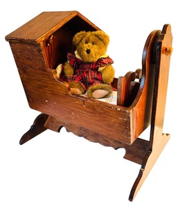 lot 84 image: Vintage Wooden Doll Cradle with Teddy Bear
