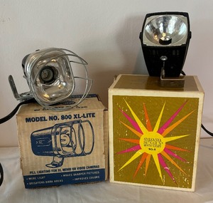 lot 111 image: Vintage Sylvania Sun-Gun Movie Light SG-8 and Acme-Light 800 XL-LITE