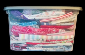 lot 308 image: Large Bin of Children Themed Fabric Remnants in Bright Patterns