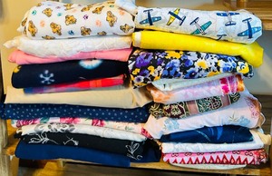 lot 392 image: Large Lot of Bright Fun Remnants and Yardage Fabric Prints