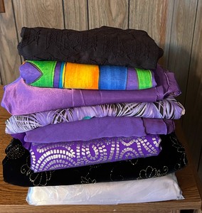 lot 347 image: Bring and Colorful Fabric Remnants including Purple Hued Fabric Remnants