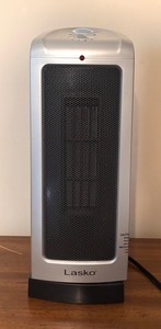lot 493 image: Lasko Model 5307 Tower Heater with Oscillation and Adjustable Thermostat