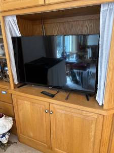 lot 229 image: 50-Inch Flat Screen Television with Remote and Stand