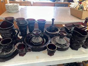 lot 613 image: Large Collection of Avon Cape Cod 1876 Ruby Red Glassware Collection with Goblets and Pitchers