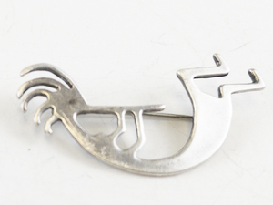 lot 28 image: Dancing Kokopelli Sterling Silver Brooch .