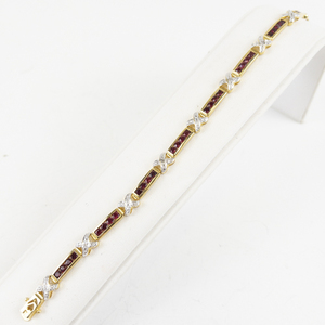 lot 32 image: Lab Grown Ruby Two-Tone Sterling Silver Tennis Bracelet.