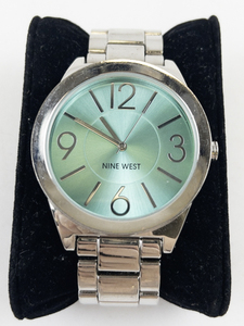 lot 60F image: Ladys Nine West  Teal & Silver Tone stainless steel and base metal Quartz Analog watch. New Battery Installed