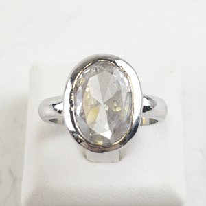 lot 91 image: Oval Cut CZ Silver Tone Base Metal Statement Ring . Size 7.5 - 7.75.