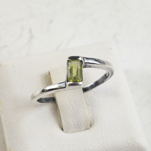 lot 99 image: Dainty Peridot Baguette Sterling Silver Ring.  