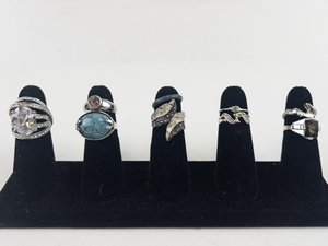 lot 106 image: Group of 8 Silver Tone Base Metal Rings . Size 6.5-7.