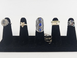 lot 107 image: Group of 10 Silver Tone Base Metal  Rings . Size 5--6.