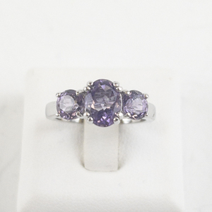 lot 113 image: Three Stone Amethyst Silver Tone Base Metal Ring. Size 6 - 6.25.