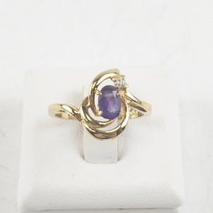 lot 114 image: Amethyst & CZ Gold Tone Base Metal Ring. Size 6 - 6.25.