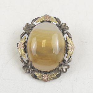 lot 175 image: Tri-Tone Sterling Silver Brooch .