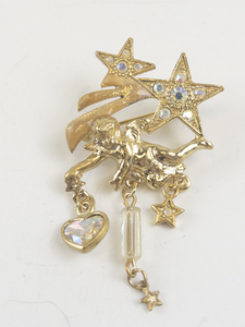 lot 180 image: Kirks Folly Winged Cherub Shooting Stars Gold Tone base Metal Brooch. 