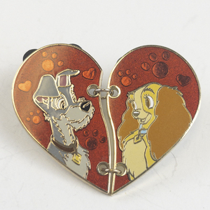 lot 184 image: Disney Lady & The Tramp Split Heart Gold Tone Base Metal Lapel Pin.