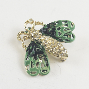 lot 185 image: Rhinestone Accented Green Bug Gold Tone Base Metal Brooch .