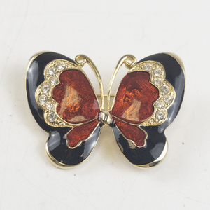 lot 191 image: Red & Black Butterfly Gold Tone Base Metal Brooch .