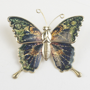 lot 197 image: Colorful Butterfly Gold Tone Base Metal Brooch .