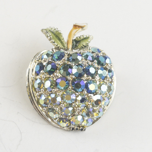 lot 199 image: Blue & White CZ Apple Gold Tone Base Metal Brooch .