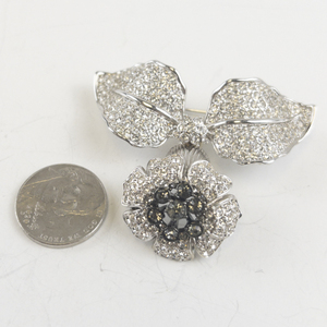 lot 211 image: Rhinestone Flower Silver Tone Base Metal Brooch .