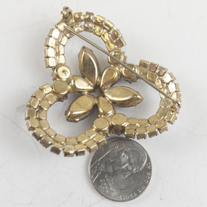 lot 212 image: Purple Rhinestone Gold Tone Base Metal Brooch .
