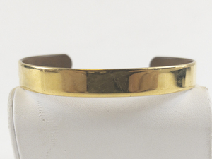lot 261 image: Sabona  Basic Gold Tone Base Metal Cuff Bracelet.
