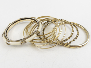 lot 264 image: Group of 4  Gold Tone Bangles .