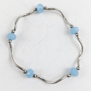 lot 265 image: Twisted Blue Silver Tone Base Metal Bracelet.