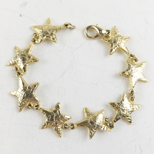 lot 268 image: Star Link Gold Tone Base Metal Bracelet.