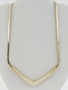 lot 282 image: Trifari  Vintage Cream Enamel V Gold Tone Base Metal Necklace.