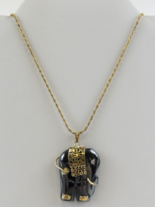 lot 285 image: Vintage Hematite Elephant Gold Tone Base Metal Pendant Necklace .