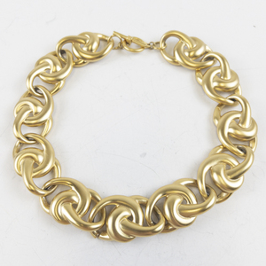 lot 291 image: Anne Klein Chunky Love Knot Gold Tone Base Metal Collar Necklace.