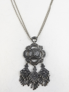 lot 293 image: TINN (Norway)  Vintage Ornate Dangling Silver Tone Base Metal Pendant Necklace .