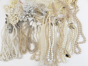 lot 340 image: Huge Bag Of Faux Pearl Bead Necklaces.